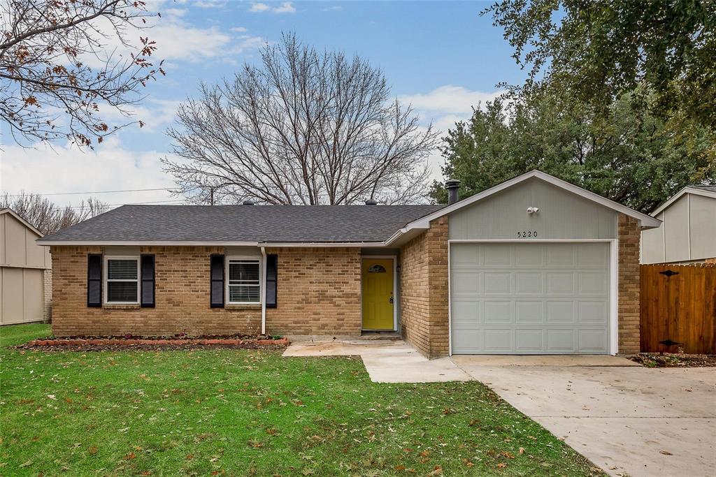 5220 Arbor Glen Road The Colony, TX 75056 - Photo 2 of 29 a front view of house with yard and trees in the background