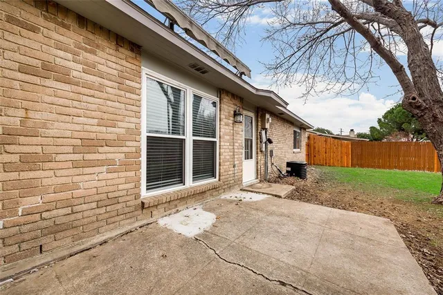 a view of a house with a yard and garage