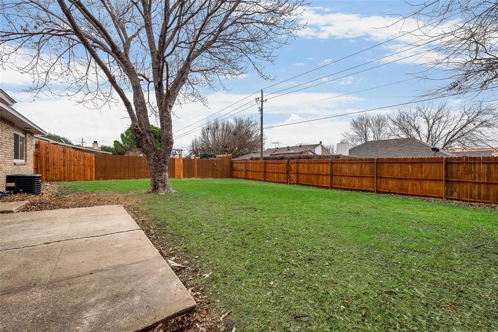 5220 Arbor Glen Road The Colony, TX 75056 - Photo 27 of 29 a view of a backyard with a tree