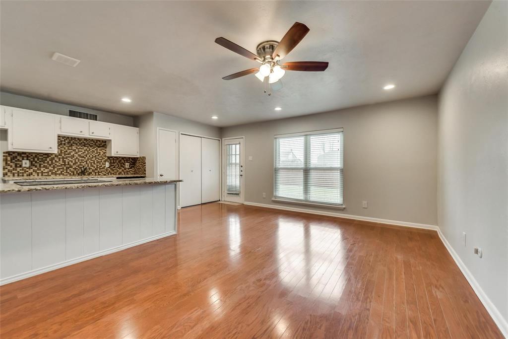 5220 Arbor Glen Road The Colony, TX 75056 - Photo 7 of 29 a view of an empty room with window and wooden floor