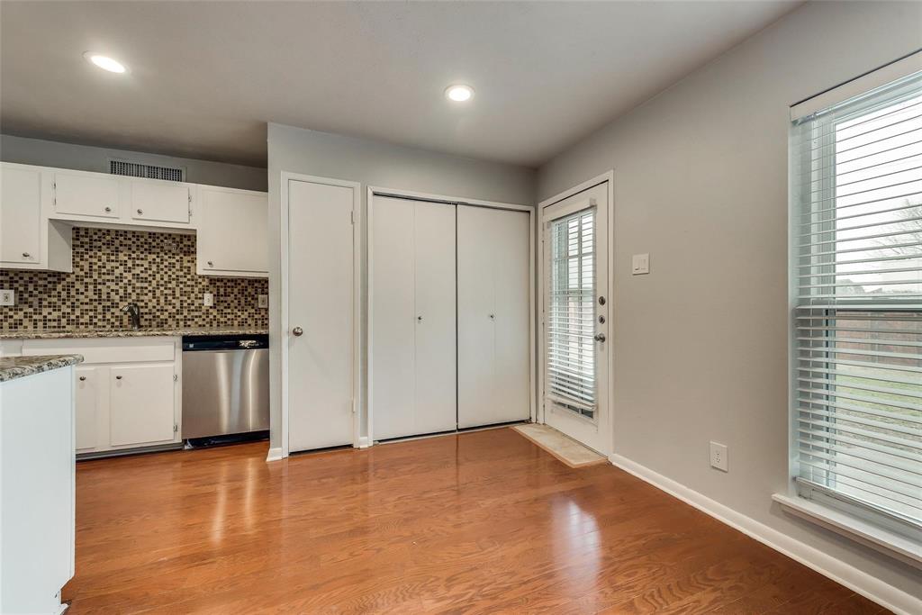 5220 Arbor Glen Road The Colony, TX 75056 - Photo 9 of 29 a view of a kitchen with a sink and dishwasher a refrigerator with white cabinets