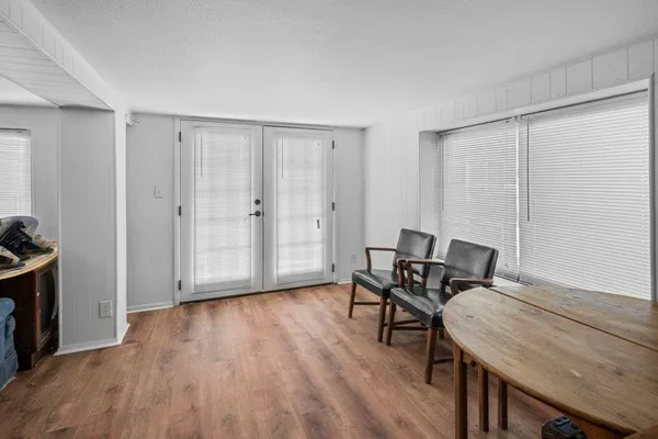 a workspace with furniture and wooden floor