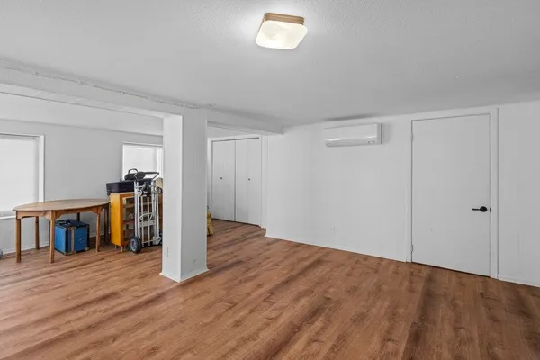 a view of a storage & utility room with wooden floor