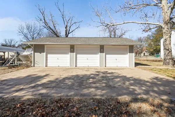 a view of a parking space with a garage