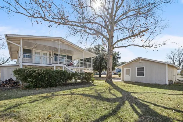 a view of a house with a yard covered with snow in front of house