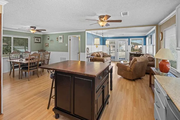 a view of a dining room with furniture window and outside view