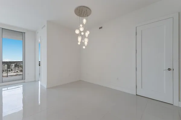 a view of a kitchen and chandelier