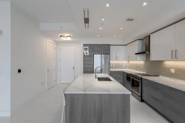 a kitchen with a table and chairs in it