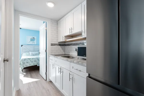 a kitchen with a sink and cabinets