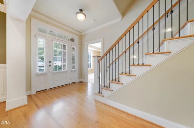 a view of an entryway with wooden floor