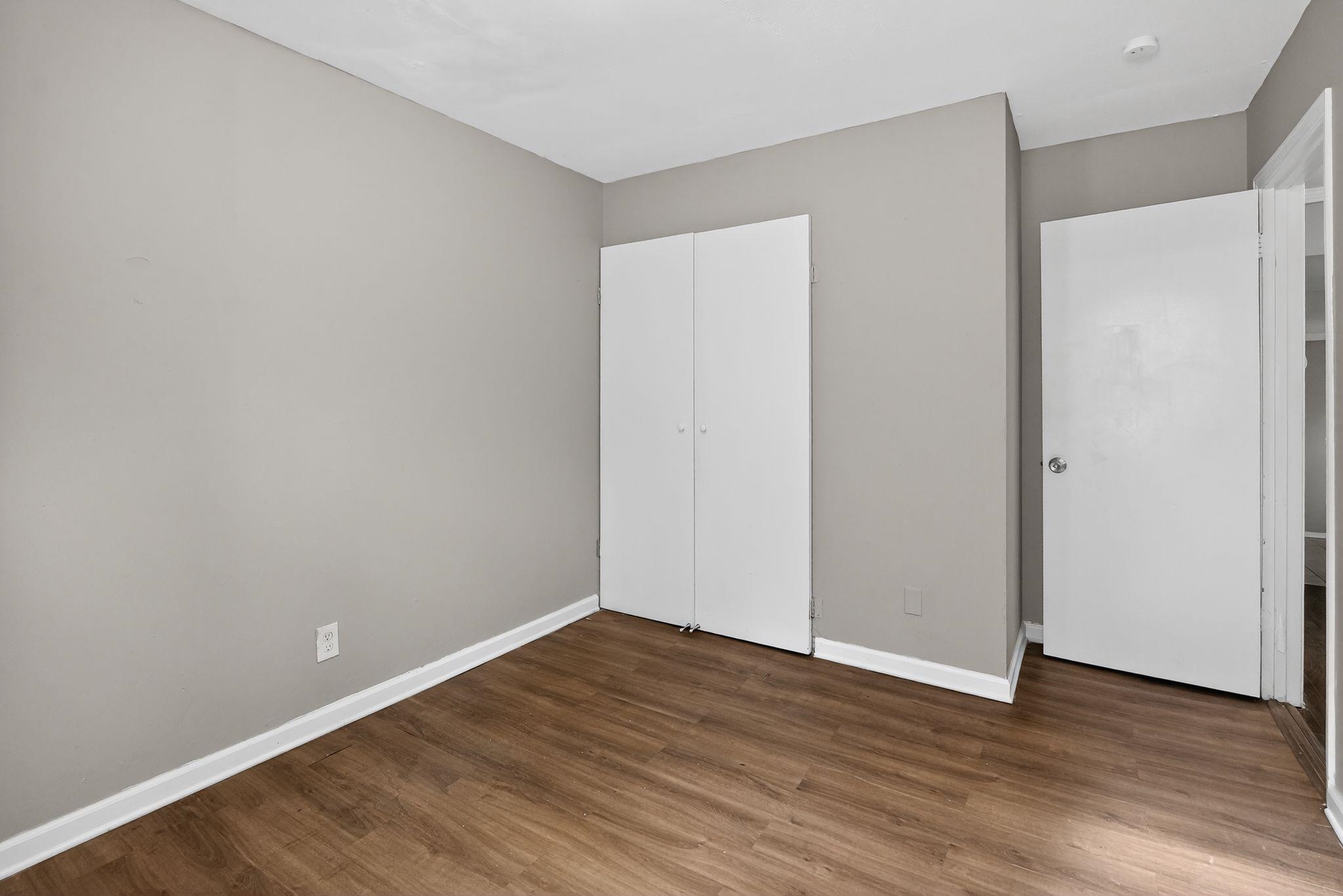 3981 Maynard Drive Memphis, TN 38109 - Photo 16 of 31 a view of an empty room with wooden floor
