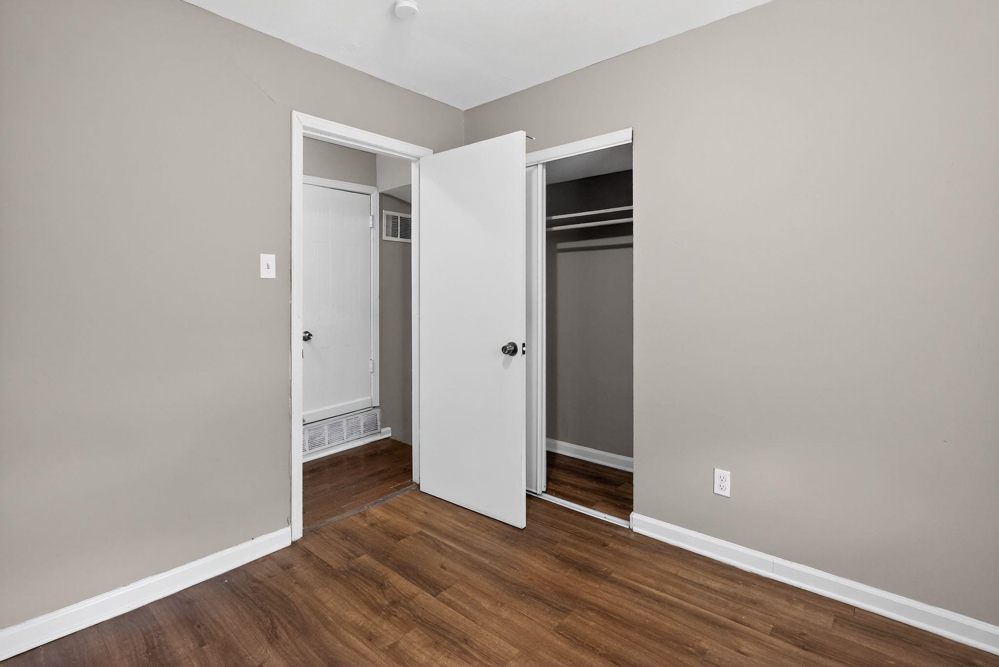 3981 Maynard Drive Memphis, TN 38109 - Photo 17 of 31 an empty room with wooden floor and entrance