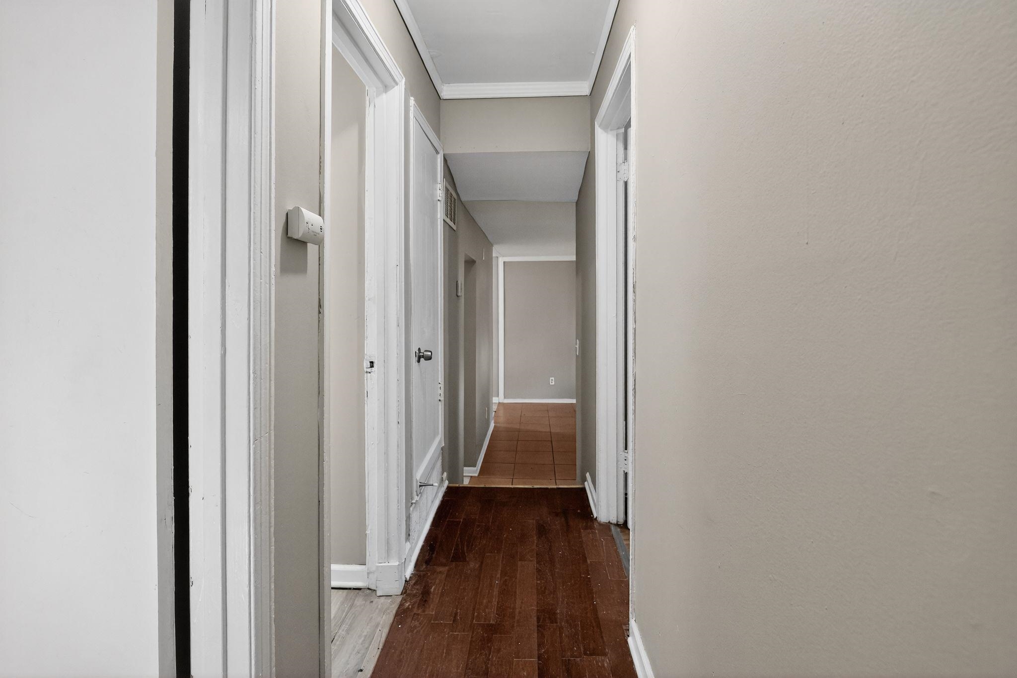 3981 Maynard Drive Memphis, TN 38109 - Photo 23 of 31 a view of a hallway with a wooden floor