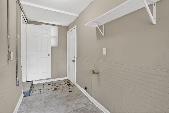 a bathroom with a shower and a sink