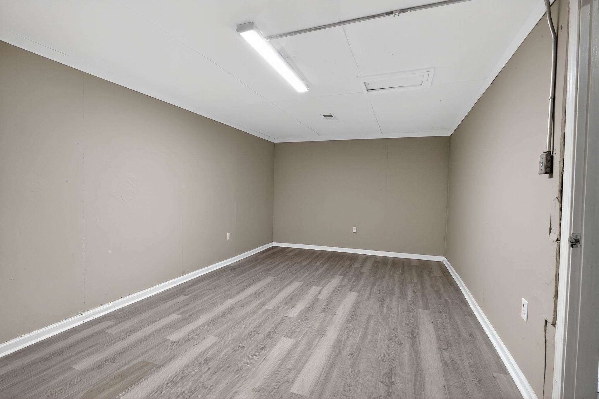 3981 Maynard Drive Memphis, TN 38109 - Photo 6 of 31 a view of an empty room with wooden floor