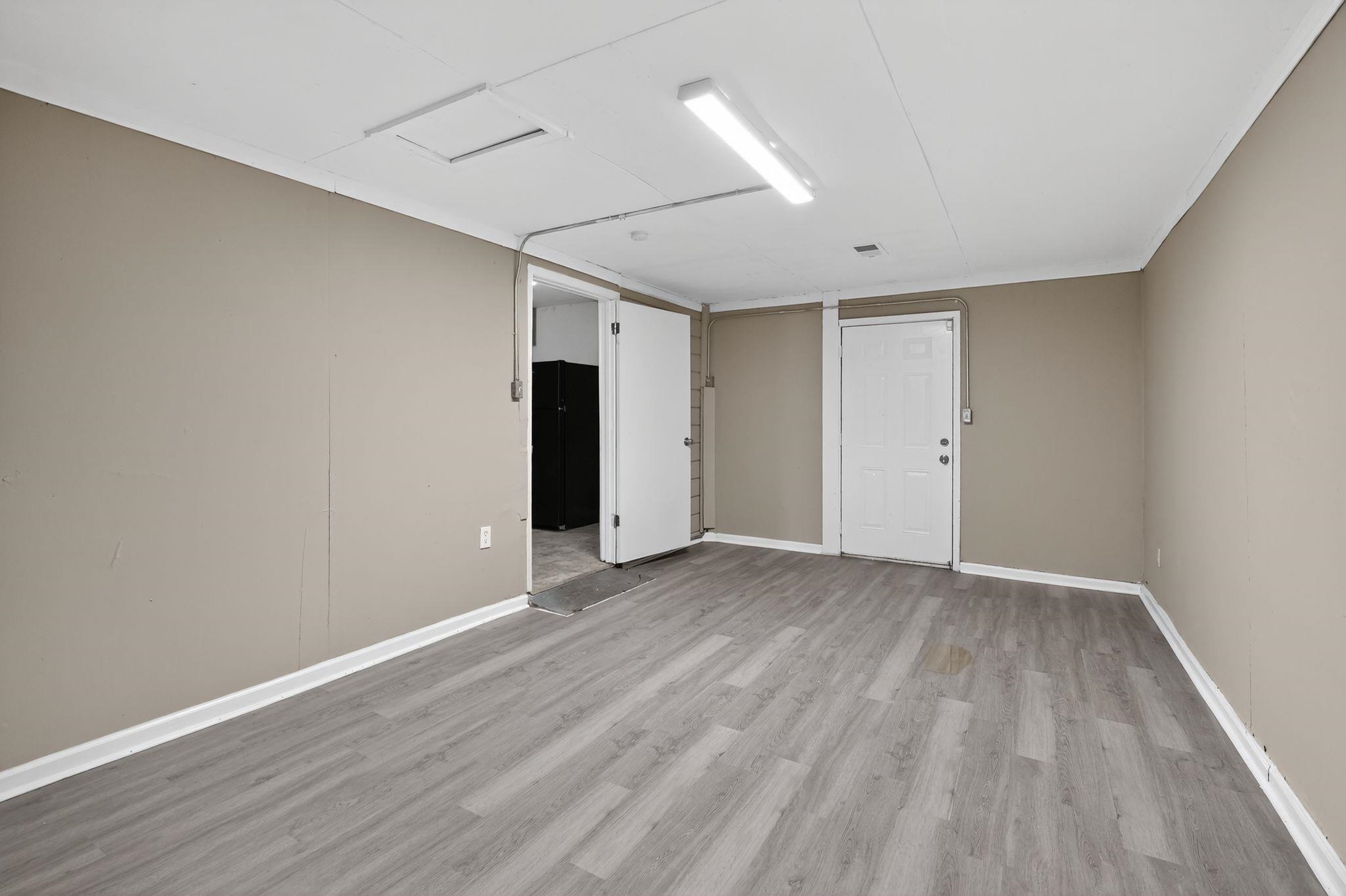 3981 Maynard Drive Memphis, TN 38109 - Photo 7 of 31 a view of an empty room with wooden floor