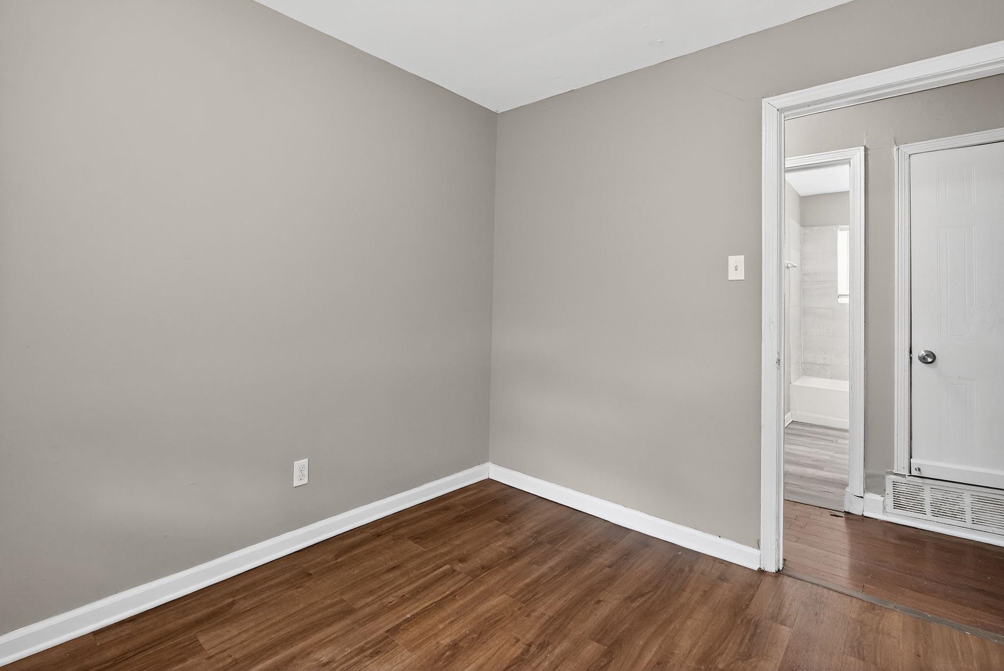 3981 Maynard Drive Memphis, TN 38109 - Photo 8 of 31 a view of an empty room with wooden floor