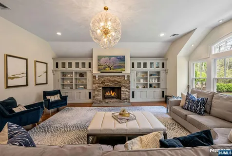 a living room with hard wood floors and a window
