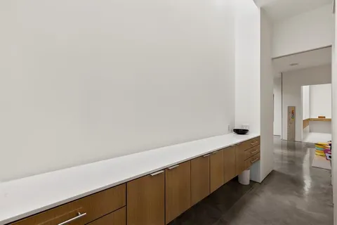 a porch with a table and chairs