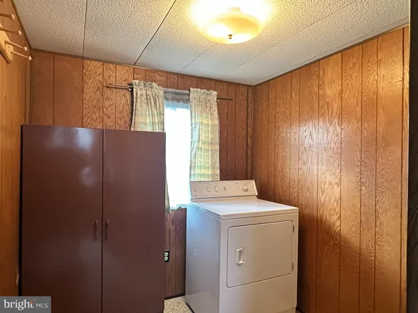 a view of a bathroom that has a window in it