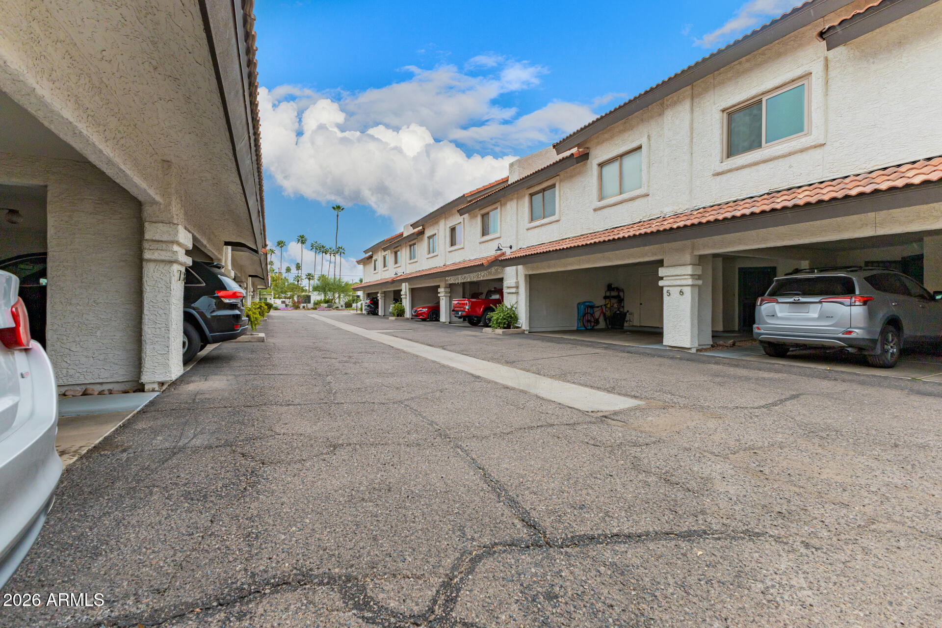 a view of street with parked cars