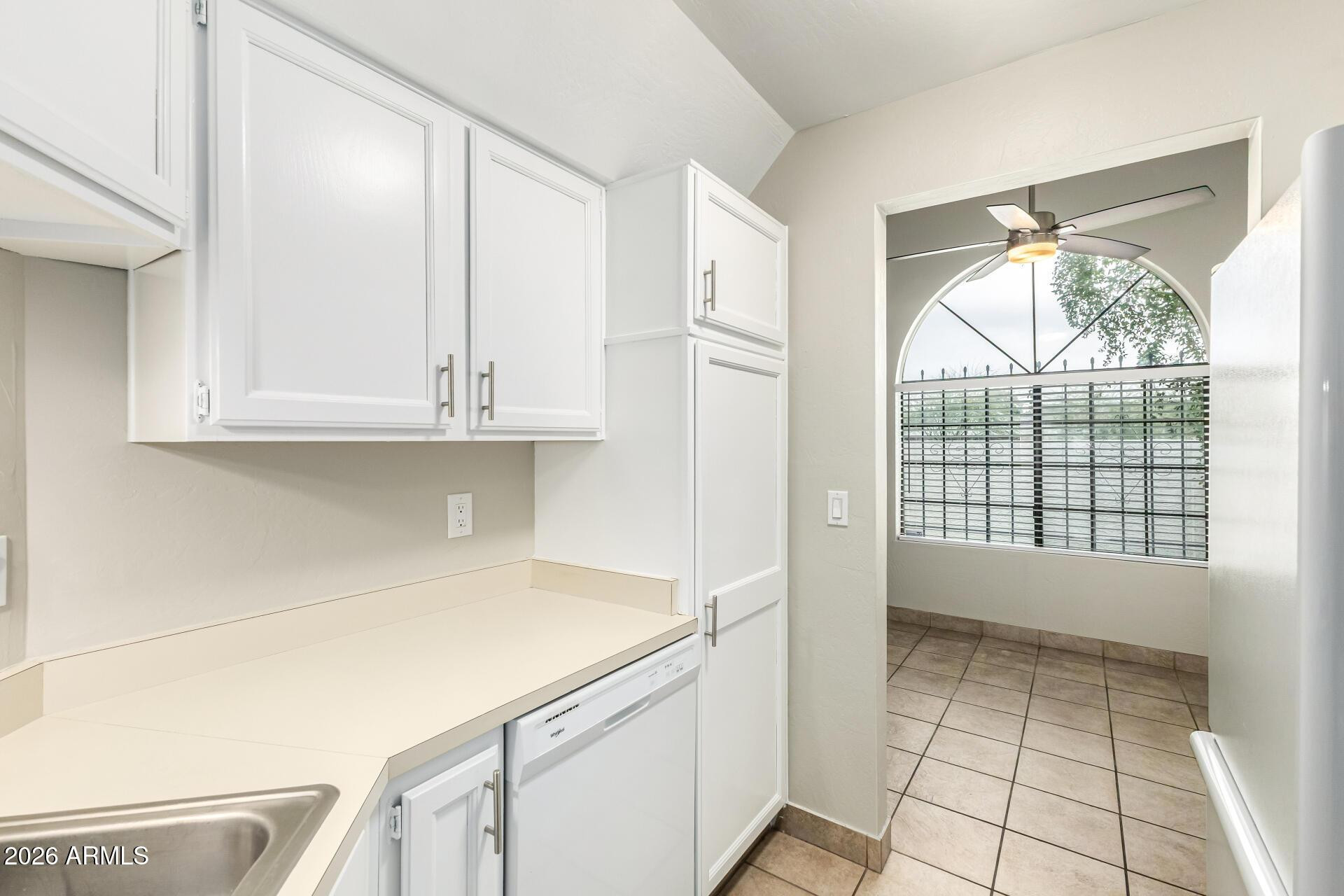 4328 North 36th Street, Unit 3 Phoenix, AZ 85018 - Photo 12 of 28 a view of kitchen with a sink dishwasher and wooden cabinets