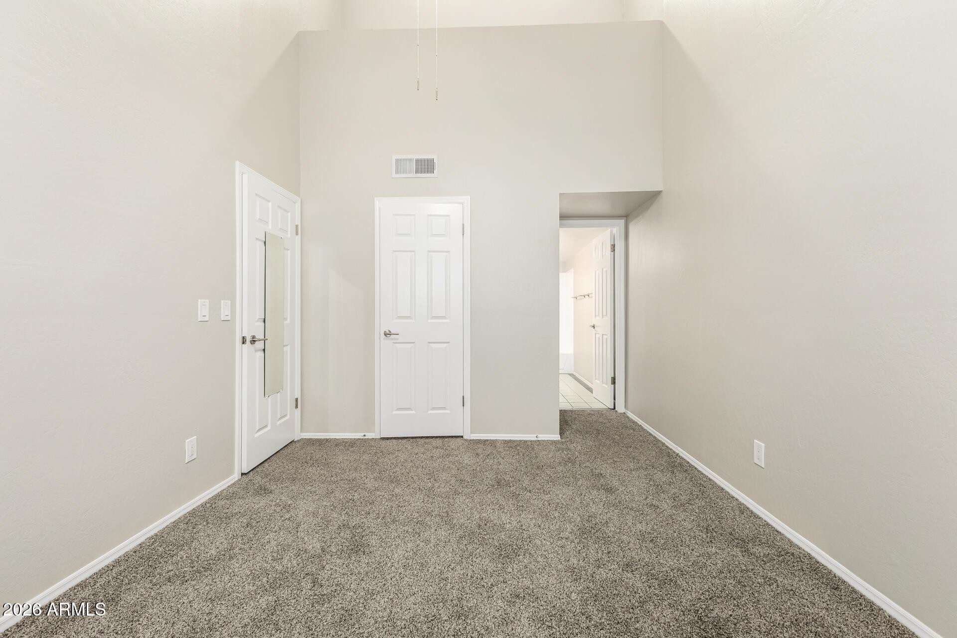 4328 North 36th Street, Unit 3 Phoenix, AZ 85018 - Photo 16 of 28 an empty room with a door