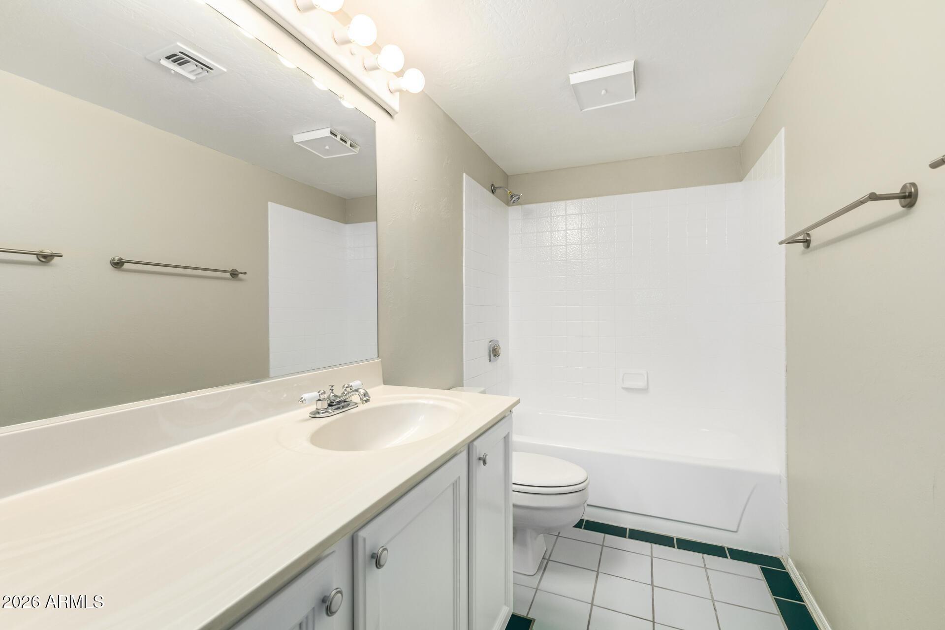4328 North 36th Street, Unit 3 Phoenix, AZ 85018 - Photo 17 of 28 a bathroom with a sink a toilet and shower