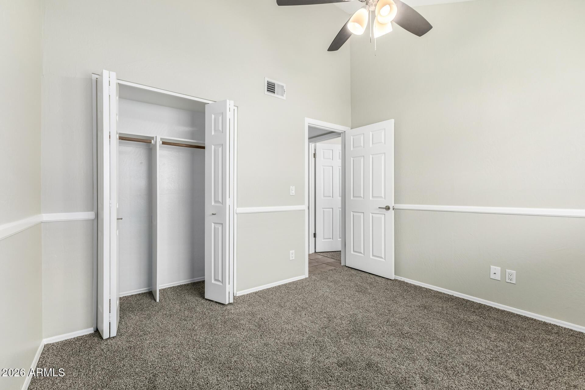 4328 North 36th Street, Unit 3 Phoenix, AZ 85018 - Photo 20 of 28 an empty room with a ceiling fan and a window