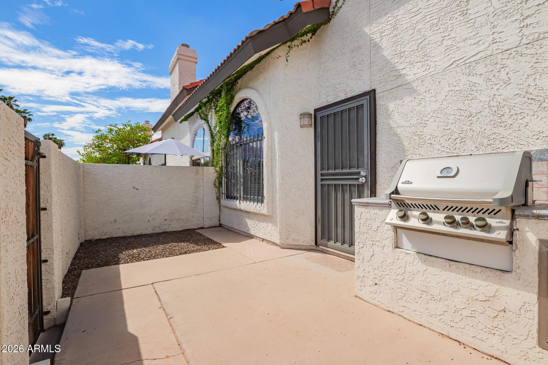 4328 North 36th Street, Unit 3 Phoenix, AZ 85018 - Photo 23 of 28 a view of a house with a wooden fence