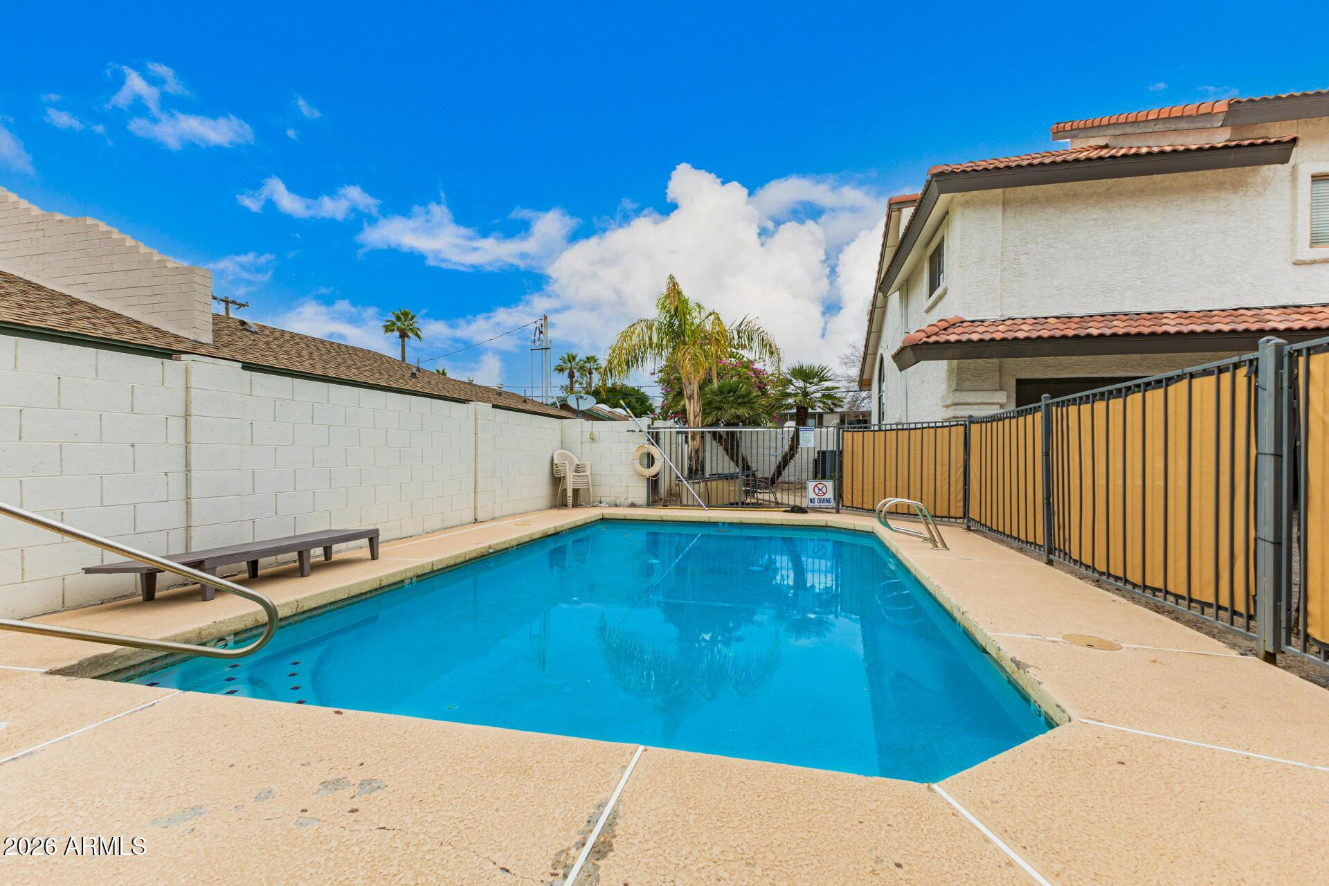 4328 North 36th Street, Unit 3 Phoenix, AZ 85018 - Photo 26 of 28 a backyard with a table and chairs