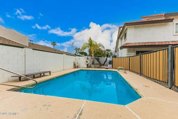 a view of a back yard with an umbrella