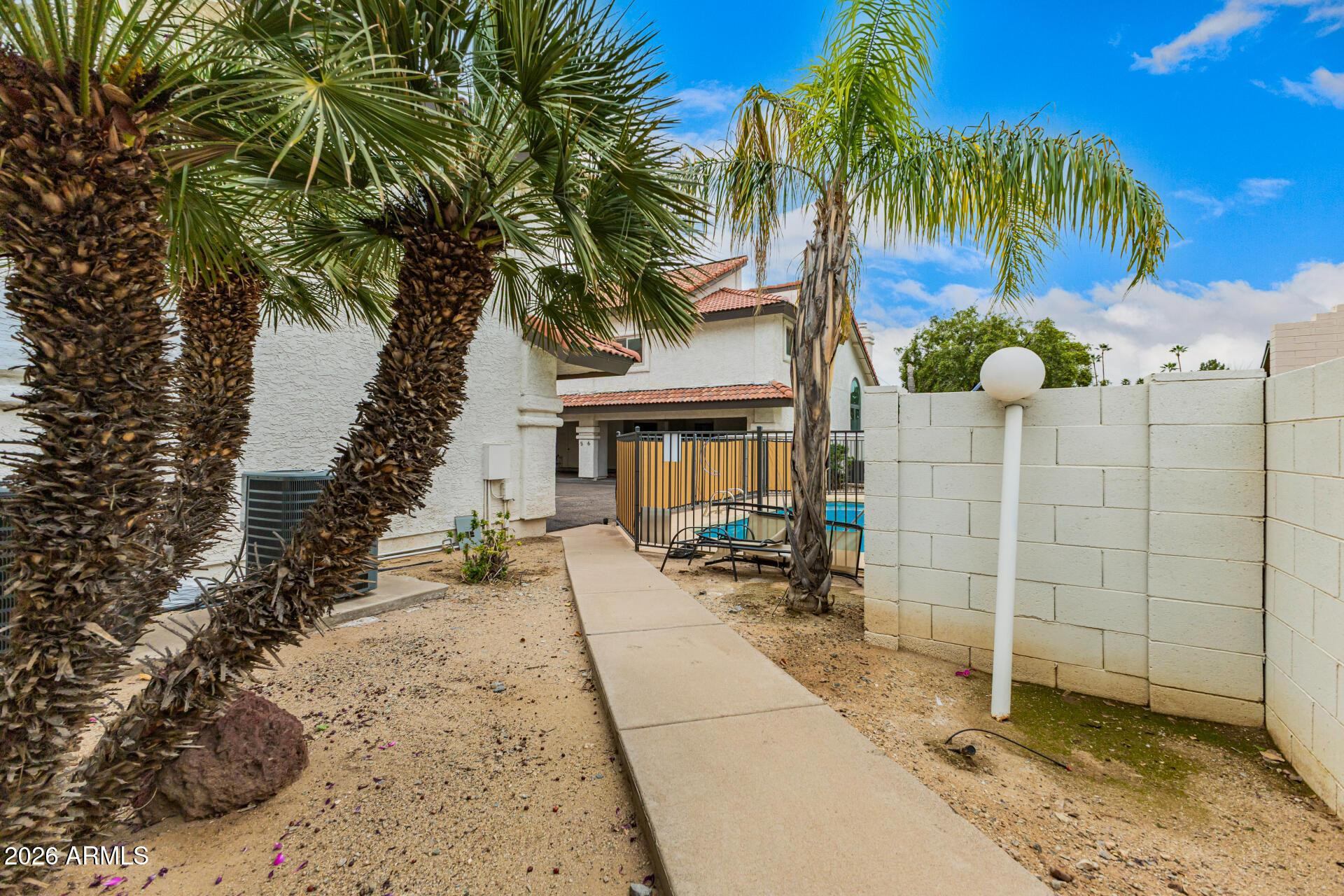 4328 North 36th Street, Unit 3 Phoenix, AZ 85018 - Photo 28 of 28 a view of a house with a yard and potted plants