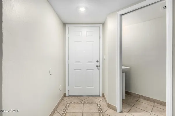 a view of an empty room window and fire place