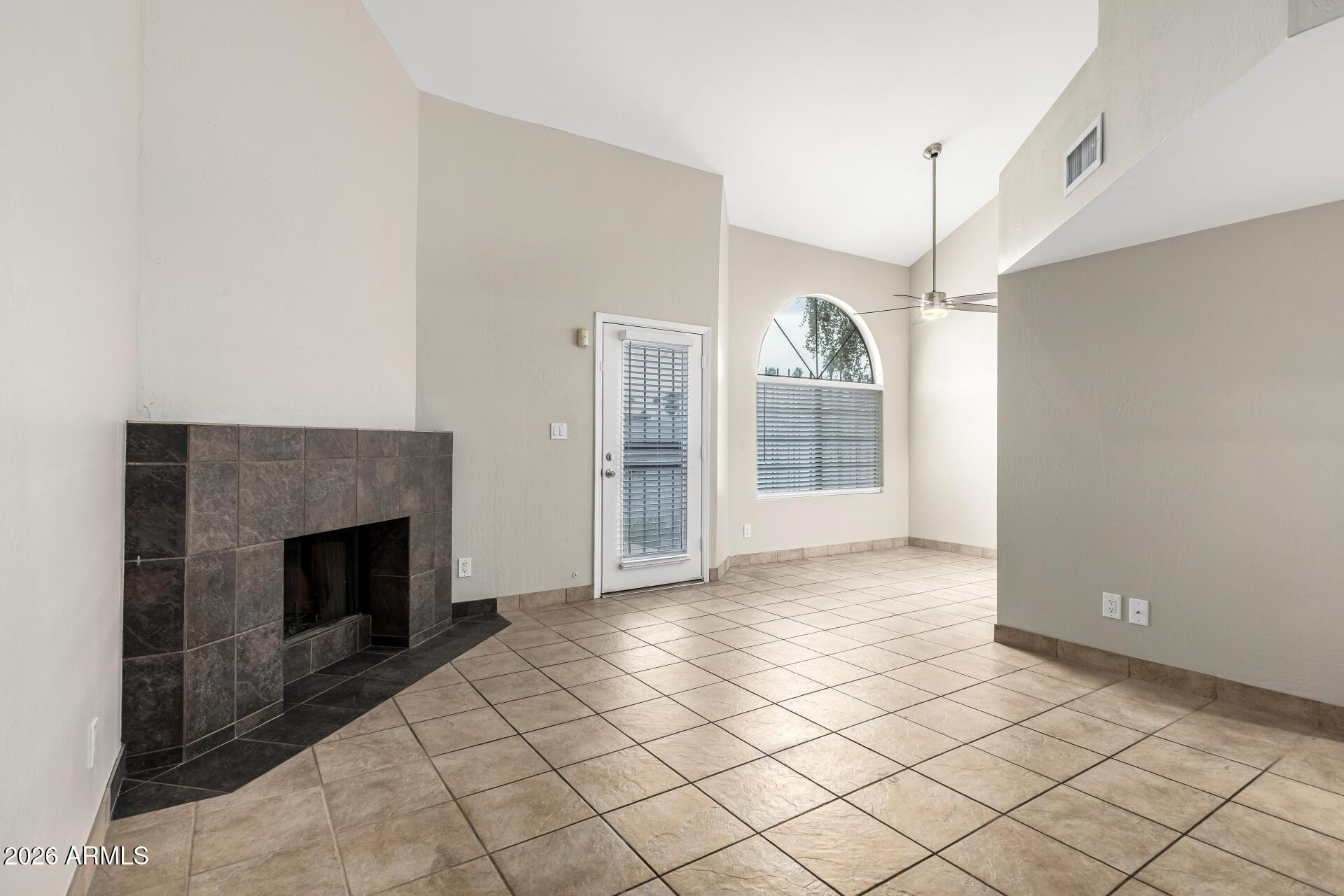 4328 North 36th Street, Unit 3 Phoenix, AZ 85018 - Photo 5 of 28 a view of an empty room with glass door and brick wall
