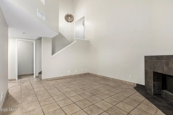 a view of an empty room with a window