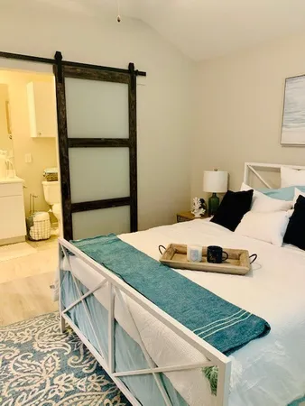 a bedroom with a bed and a dresser