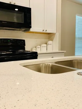 a view of kitchen sink and microwave