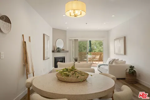 a kitchen with white cabinets appliances and sink
