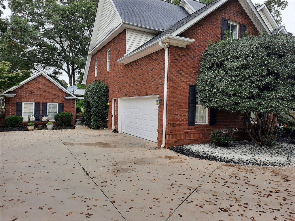 3104 Myrtlewood Anderson, SC 29621 - Photo 2 of 49 2 Car Garage with additional Brick Shed