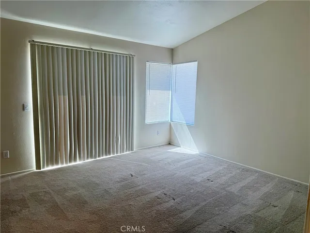 a view of empty room with windows
