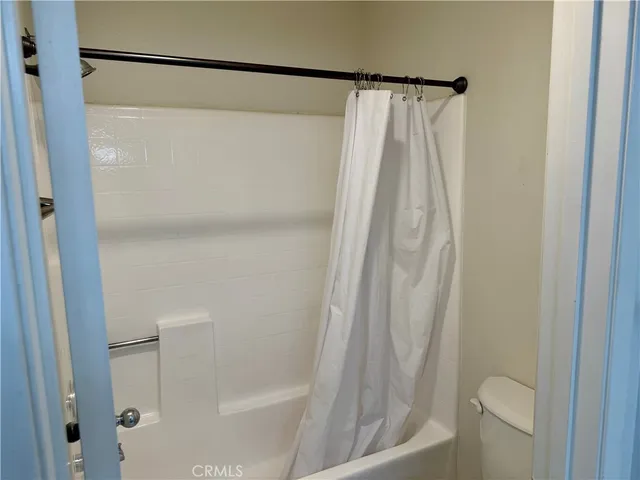a bathroom with a shower and a tub