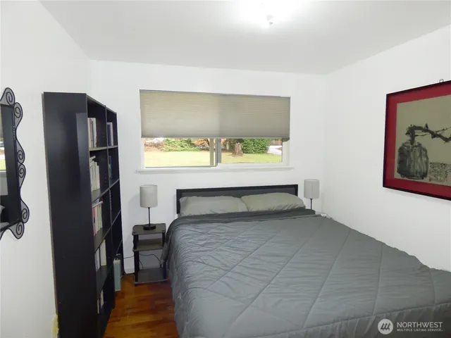 a room with a bed and a window