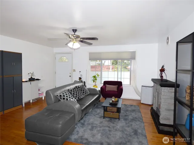 a living room with furniture and a window