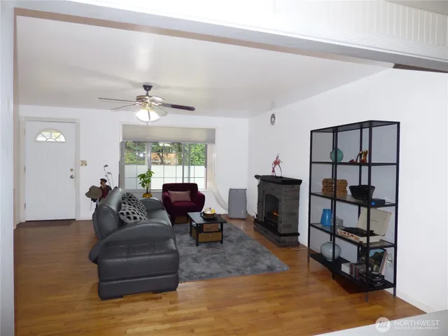a living room with furniture and a fireplace