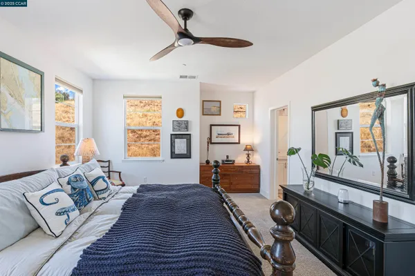 a bedroom with furniture and a window