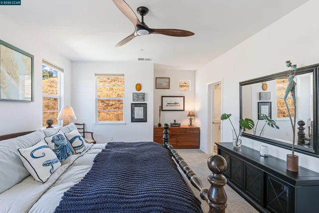 a bedroom with furniture and a window