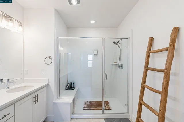 a bathroom with a shower and a sink