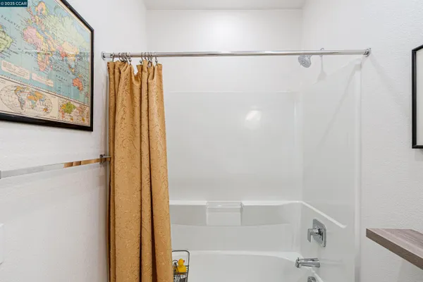 a bathroom with a shower and a tub