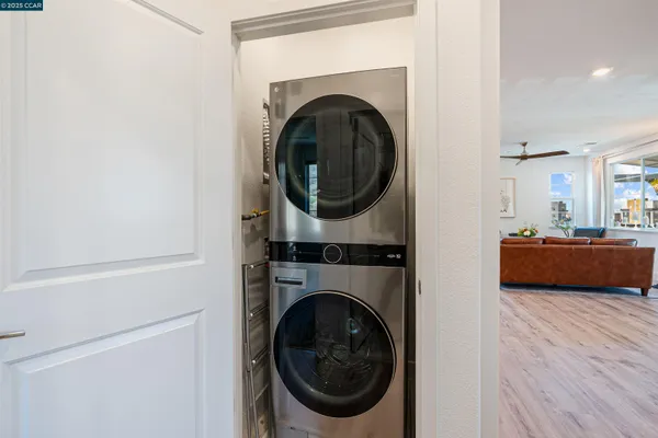 a view of entryway with wooden floor and stairs